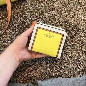 Yellow and white Kate spade wallet